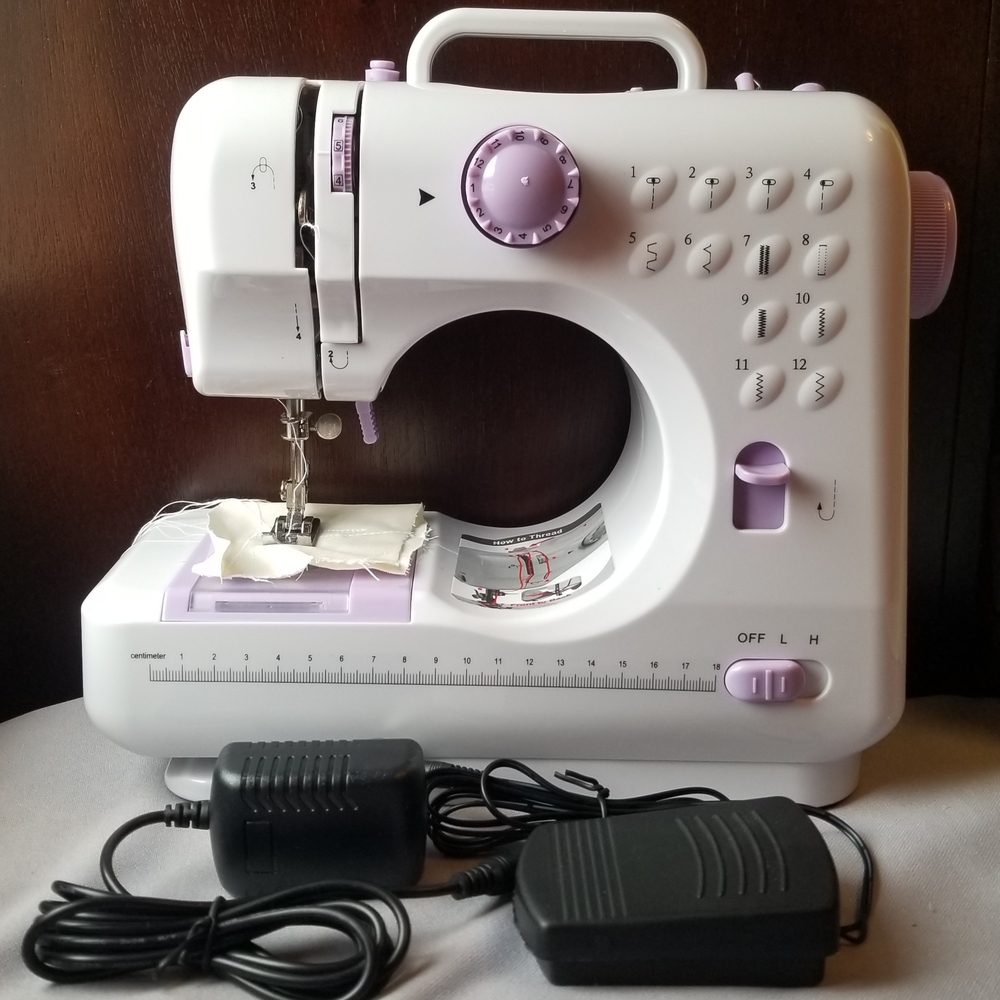 Compact White and Purple Sewing Machine